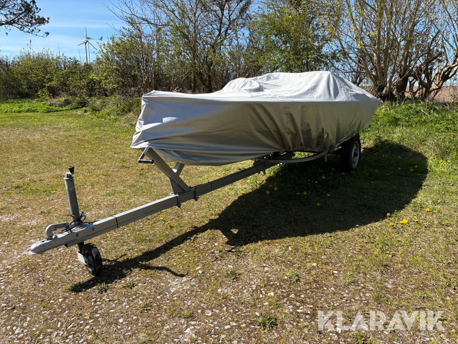 Båd med ophalningstrailer med bladfjedre