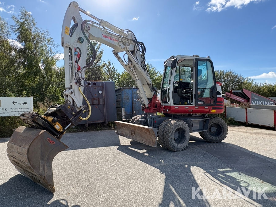Gravemaskine Takeuchi TB295W Cityboom med centralsmøring og skovlpakke