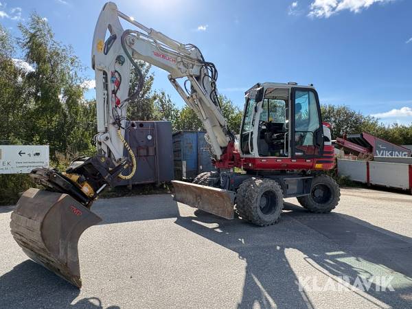 Gravemaskine Takeuchi TB295W Cityboom med centralsmøring og skovlpakke
